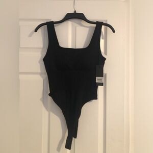 New black body suit perfect for the summertime. Size medium